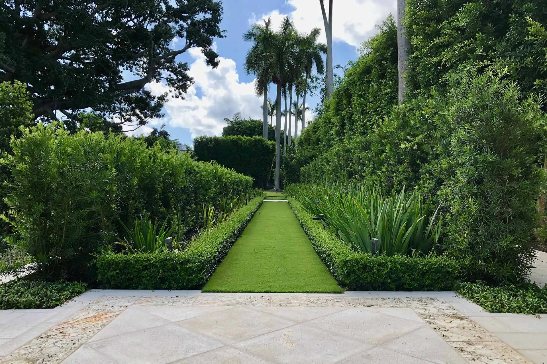 Landscaping and garden path at an estate in Palm Beach, FL.