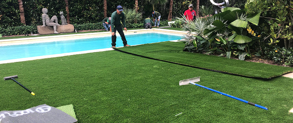 Artificial turf being installed by professionals in Palm Beach, FL.