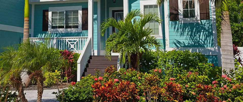 This Jupiter, FL beachfront home uses many different salt-tolerant plants in its landscaping.