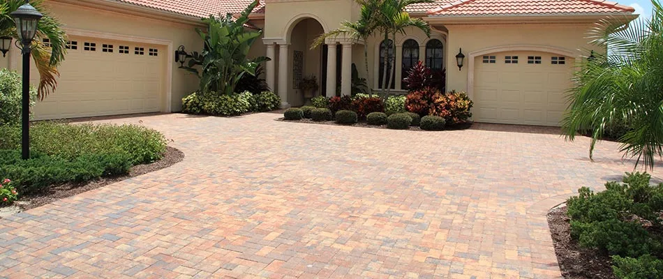 This home in Wellington, FL has a custom driveway.