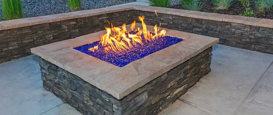 This custom fire pit in Jupiter, FL complements the surrounding area.