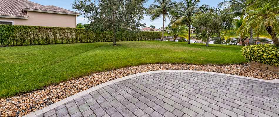 This lawn in Manalapan, FL uses our all-inclusive lawn care package.