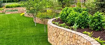 Retaining wall and plant bed at residential property in Palm Beach, FL.