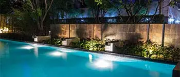 Custom water features surrounding a pool in Palm Beach, FL.