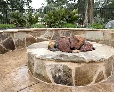 A custom fire pit and seating wall in Jupiter, FL.