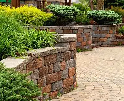 Retaining wall, landscaping, and walkway installed at a Palm Beach, FL home.